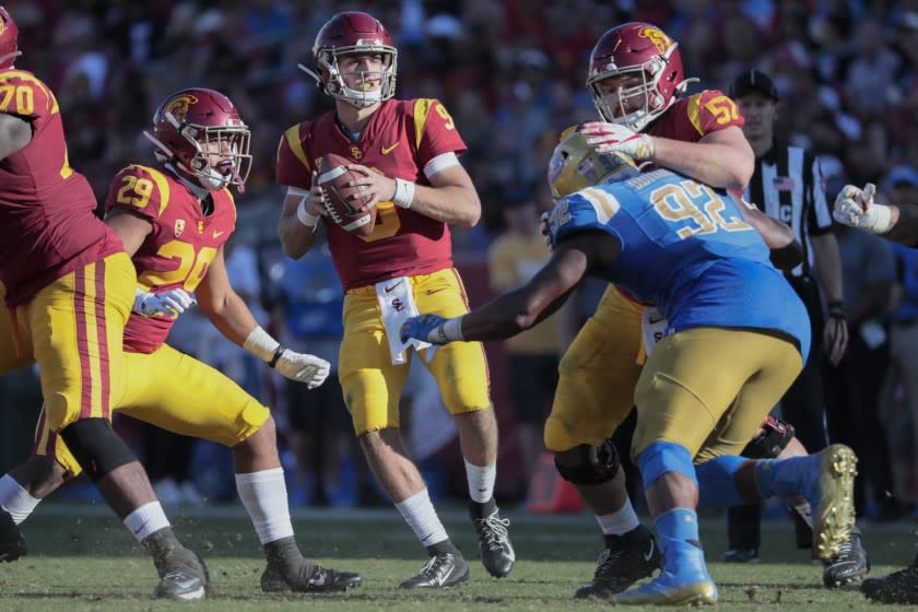 Trojans quarterback Kedon Slovis drops back to pass against the Bruins.