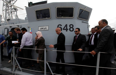 Italian Interior Minister Marco Minniti walks on a boat that was repaired in Italy, after it was handed over to the Libyan navy at Tripoli naval base, Libya, May 15, 2017. REUTERS/Ismail Zitouny