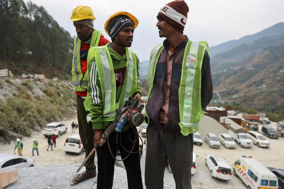 ‘Rat-hole miners’ stand before they begin manual drilling during the rescue operation in Uttarkashi, India (REUTERS)