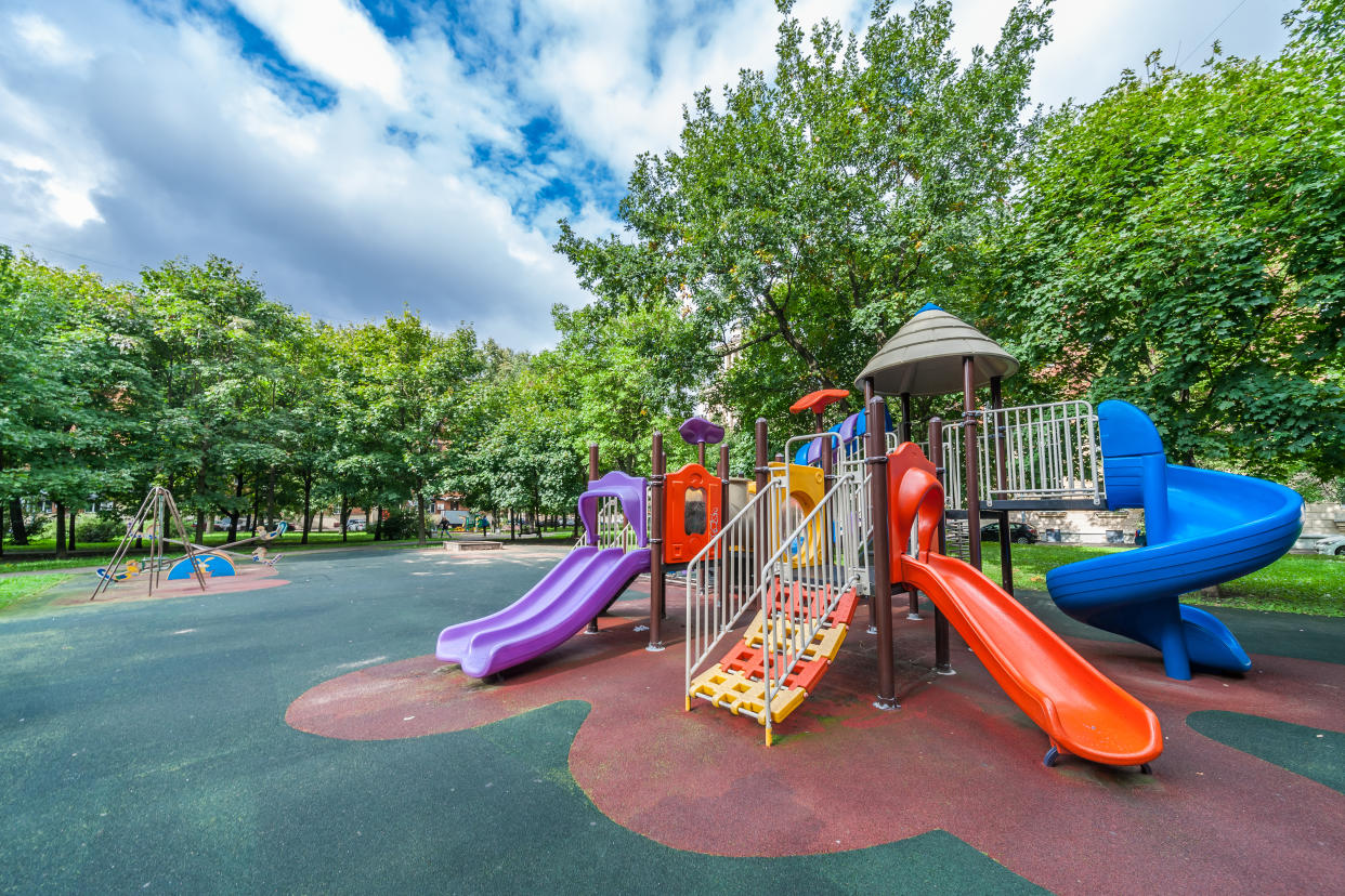 A teacher dragged a young boy by the arms from a playscape. (Photo: Miguel Sanz/Getty Images)