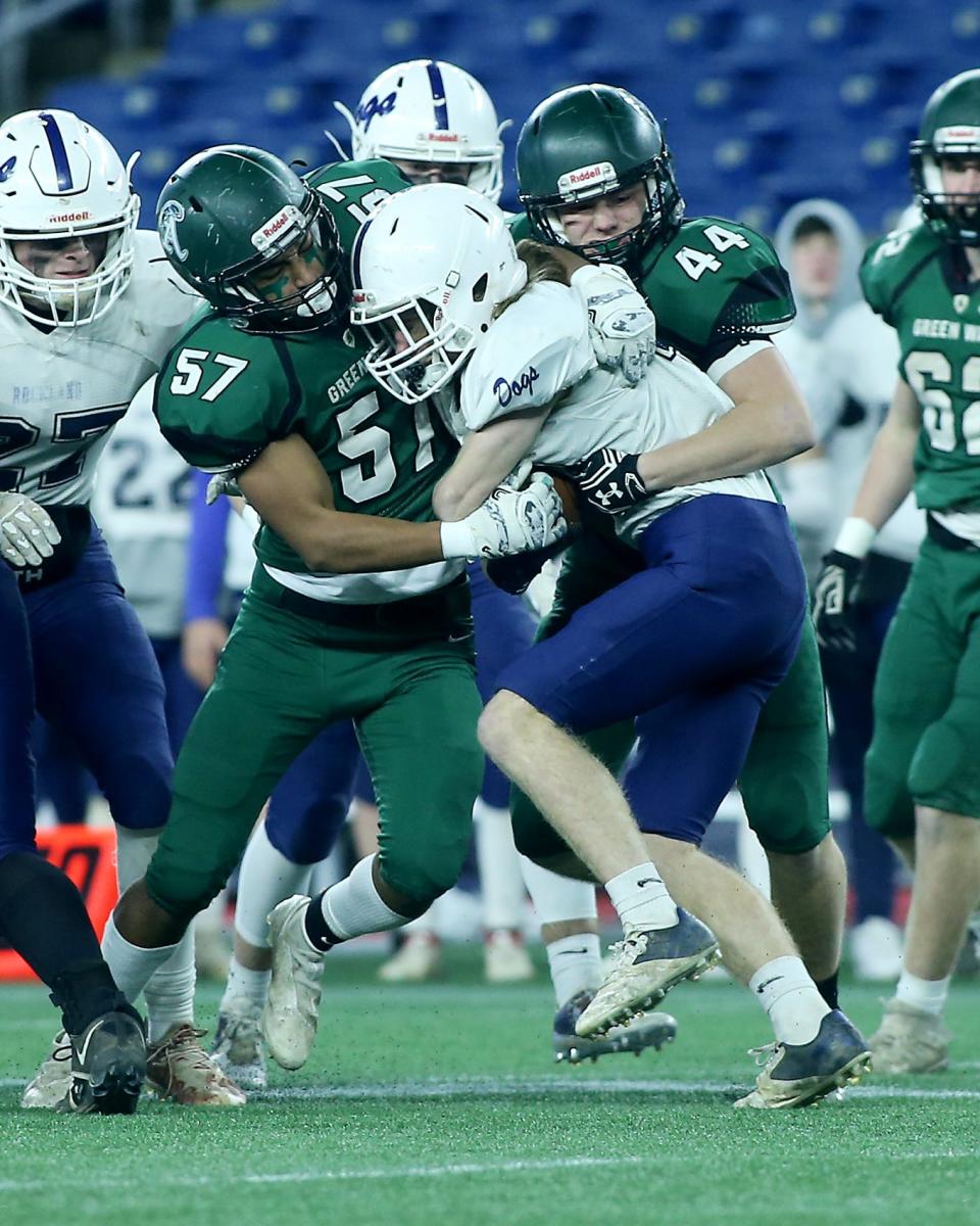 Abington’s Adam Abibi and Jack Robbins take down Rockland’s Jacob Coulstring during first quarter action of the Division 6 state title game at Gillette Stadium in Foxboro on Friday, Dec. 3, 2021.