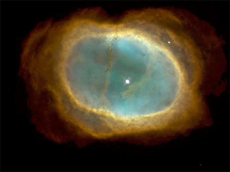 The Southern Ring Nebula, formed when the central star blew off it's outer layers, as imaged by the Hubble Space Telescope. Earth's sun may become a similar 