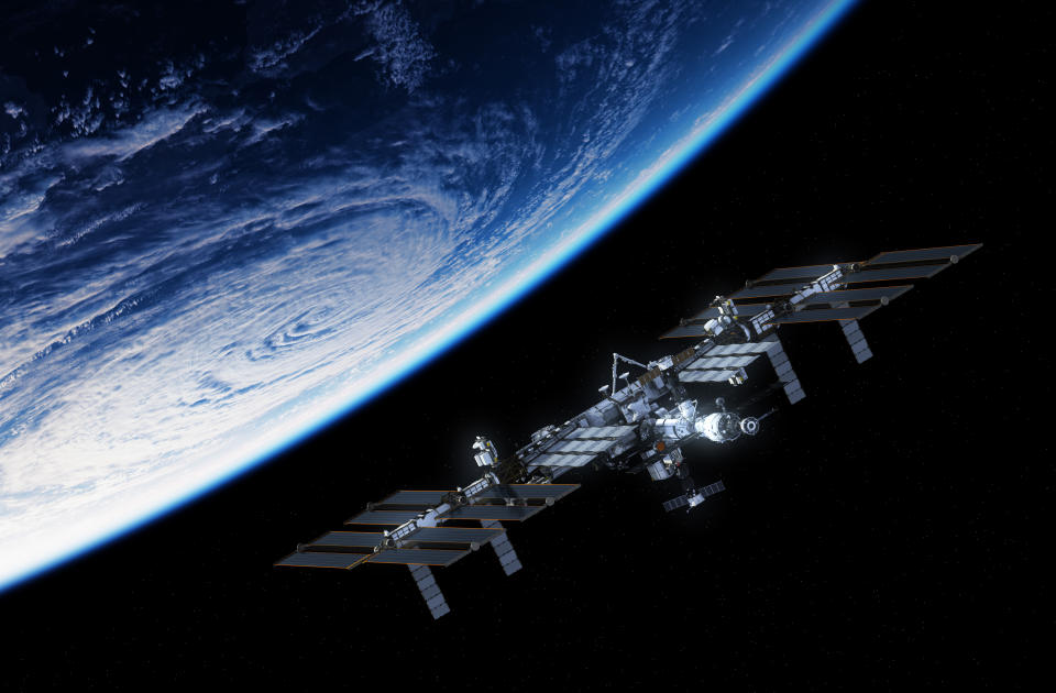 International Space Station Orbiting Planet Earth. 3D Illustration.