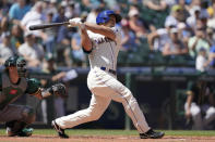 Seattle Mariners' Kyle Seager hits a two-RBI single against the Oakland Athletics during the third inning of a baseball game, Sunday, July 25, 2021, in Seattle. (AP Photo/Ted S. Warren)