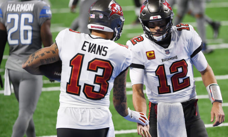 Tampa Bay Buccaneers wide receiver Mike Evans and quarterback Tom Brady shake hands.