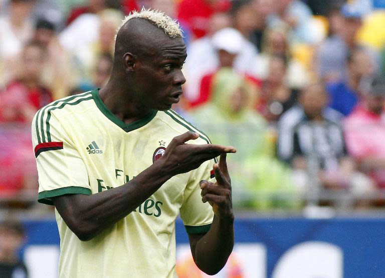 Mario Balotelli of AC Milan signals to teammates during a match against Manchester City, during International Champions Cup at Heinz Field, in Pittsburgh, Pennsylvania, on July 27, 2014