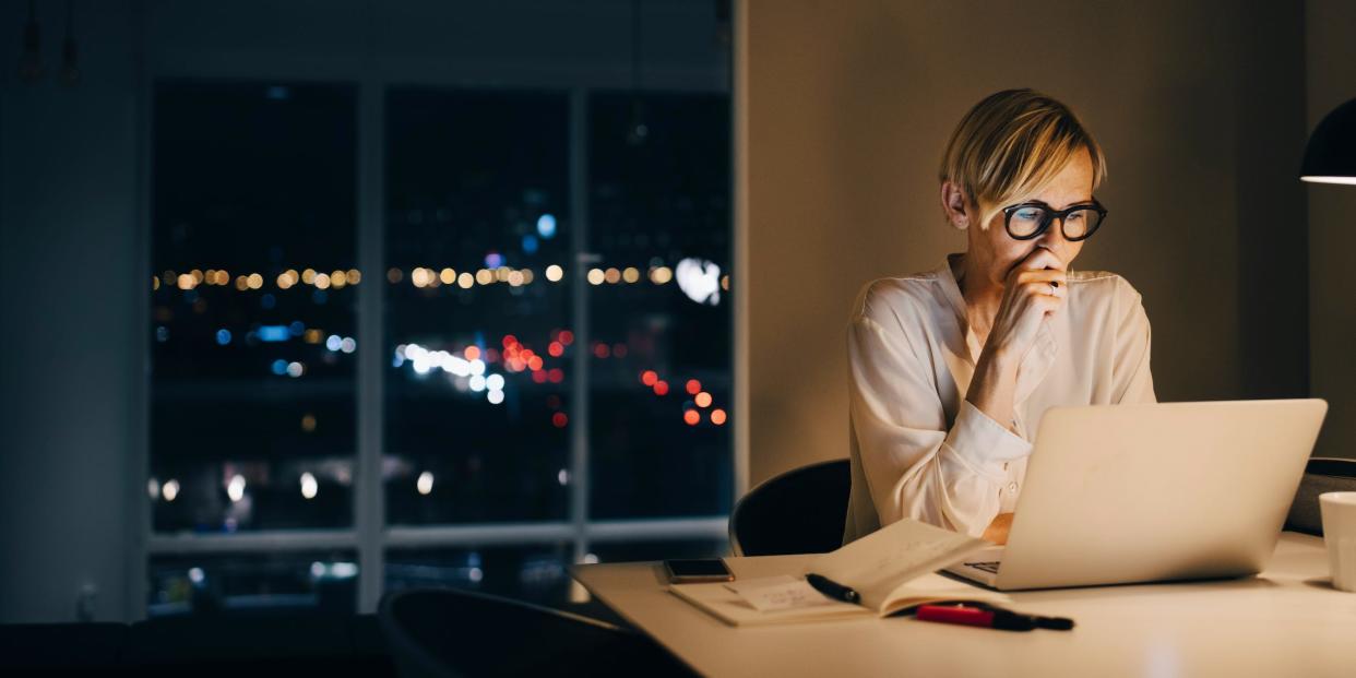 business professional working late on laptop