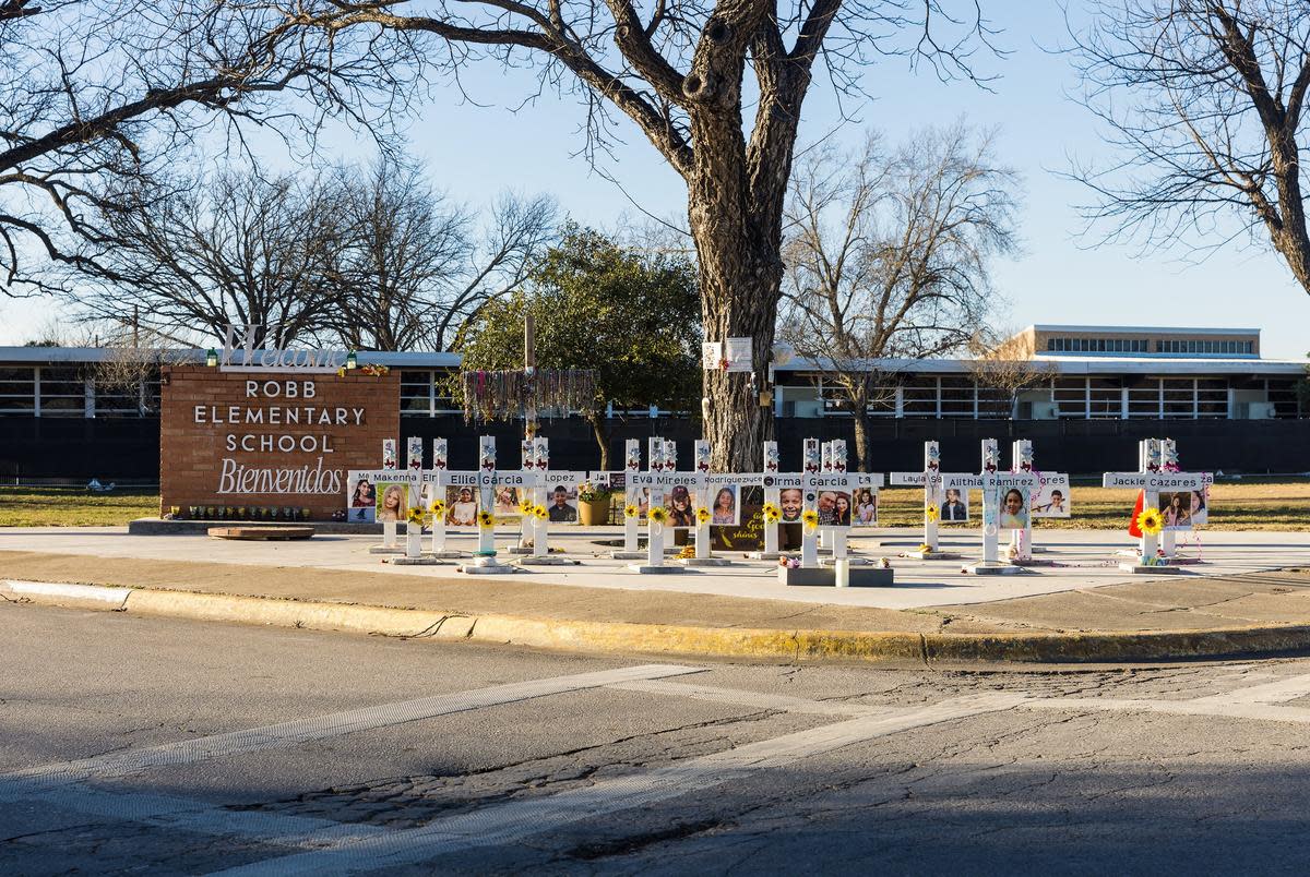 Memorial crosses outside Robb Elementary in Uvalde on Thursday, Jan. 18, 2024. The now-closed school was the site of the May 2022 mass shooting that left 19 children and two teachers dead.