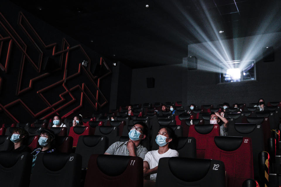 WUHAN, CHINA - JULY 20: (CHINA OUT)Residents watch a movie in a cinema in Wuhan on July 20, 2020 in Wuhan ,Hubei Province,China.Taking various measures against COVID-19, cinemas in the city reopened in an orderly manner on Monday. The China Film Administration, in a circular last week, allowed cinemas in low-risk areas to resume operation with effective epidemic prevention measures in place. (Photo by Getty Images)