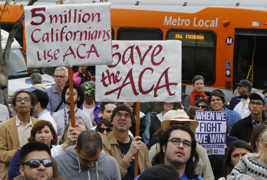 Californians join health care workers at a rally to save the Affordable Care Act across the country outside LAC+USC Medical Center in Los Angeles, Sunday, Jan. 15, 2017. The rally was one of many being staged across the country in advance of President-elect Donald Trump's inauguration on Jan. 20. Trump has promised to repeal and replace the health care law, and the Republican-controlled Senate on Thursday passed a measure taking the first steps to dismantle it. (AP Photo/Damian Dovarganes)