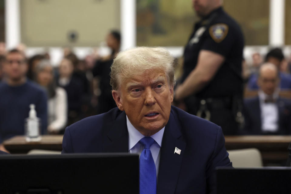FILE - Former President Donald Trump waits to take the witness stand during his civil fraud trial at New York Supreme Court, Monday, Nov. 6, 2023, in New York. A judge in Michigan is expected to hear arguments as to whether or not Secretary of State Jocelyn Benson has the authority to keep Trump’s name off any state ballot for president. Activists are suing Benson in the Michigan Court of Claims to force her to keep Trump’s name off ballots.(Brendan McDermid/Pool Photo via AP)