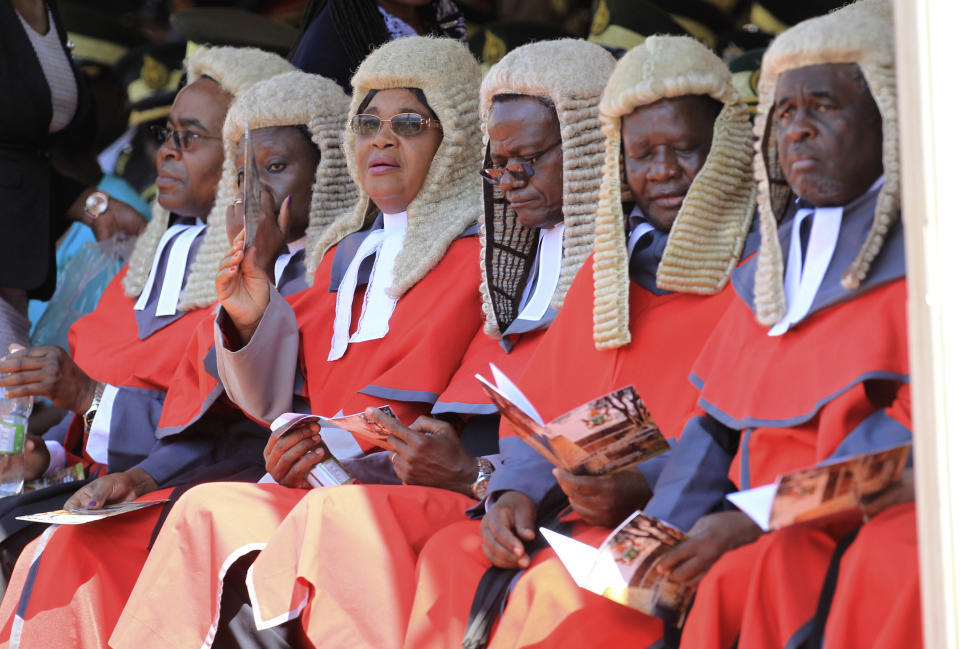 Judges are seen during the inauguration ceremony of Zimbabwean President Emmerson Mnangagwa, at the National Sports Stadium in Harare, Sunday, Aug. 26, 2018. (AP Photo/Tsvangirayi Mukwazhi)