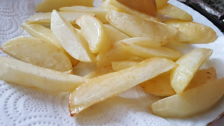 wet sliced potato on paper towel