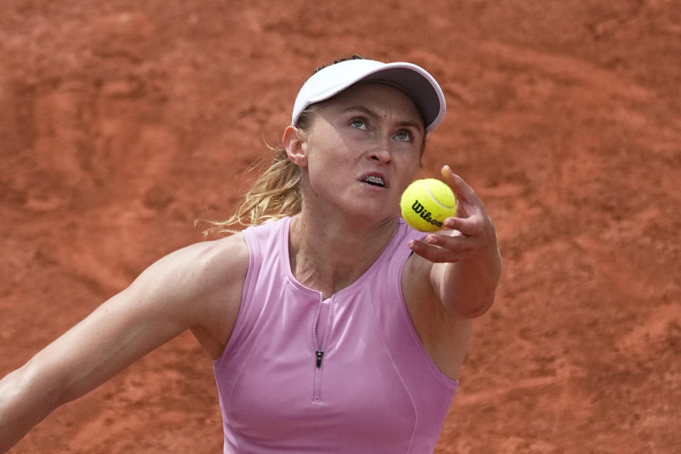 Aliaksandra Sasnovich of Belarus serves the ball to Germany's Angelique Kerber during their third round match of the French Open tennis tournament at the Roland Garros stadium Friday, May 27, 2022 in Paris. (AP Photo/Michel Euler)