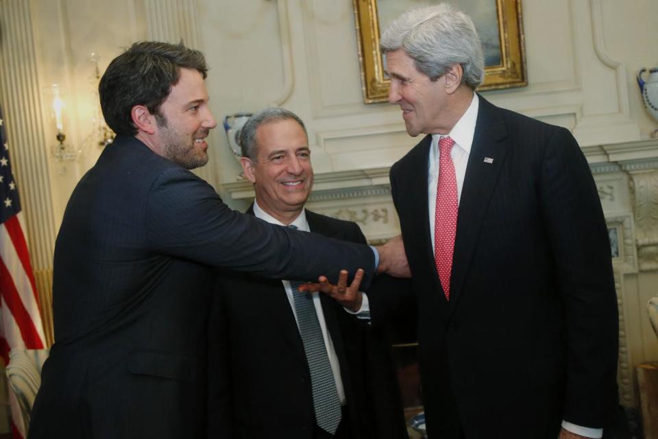 Actor Ben Affleck, left, US Special Envoy for the Great Lakes Region of Africa Russ Feingold, center, and Secretary of State John Kerry talk during a photo opportunity before their meeting about Congo, Wednesday, Feb. 26, 2014, at the State Department in Washington. (AP Photo/Charles Dharapak)