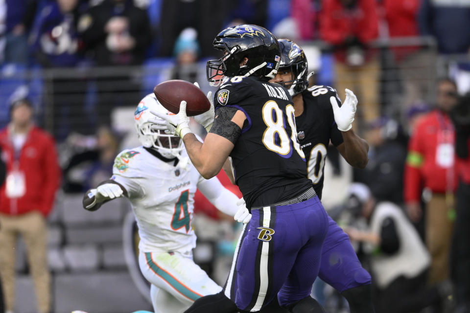 Baltimore Ravens tight end Charlie Kolar (88) catches a touchdown pass against the Miami Dolphins during the second half of an NFL football game in Baltimore, Sunday, Dec. 31, 2023. (AP Photo/Nick Wass)