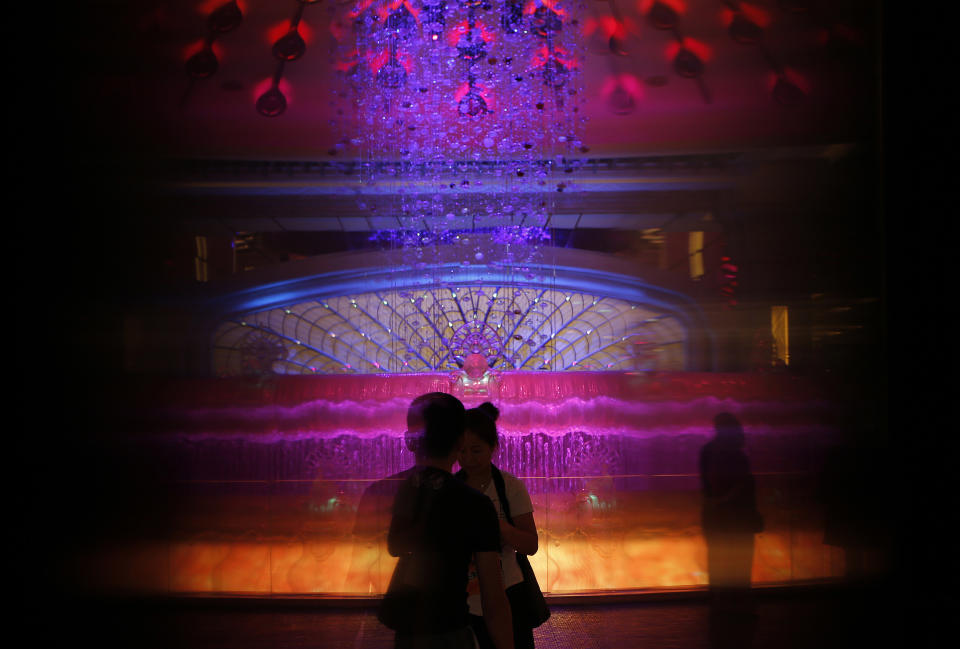 In this June 5, 2013 photo, in Macau. Mainland Chinese visitors gather at the lobby of the Galaxy casino in Macau. Macau is in the midst of one of the greatest gambling booms the world has ever known. To rival it, Las Vegas would have to attract six times as many visitors essentially every man, woman and child in America. Wynn Las Vegas now makes nearly three-quarters of its profits in Macau. Sands, which owns the Venetian and Palazzo, earns two-thirds of its revenue there. (AP Photo/Vincent Yu)