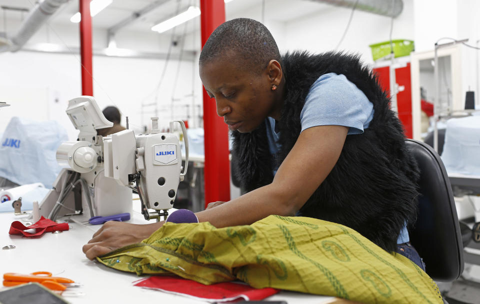 UK wages: Woman at sewing machine