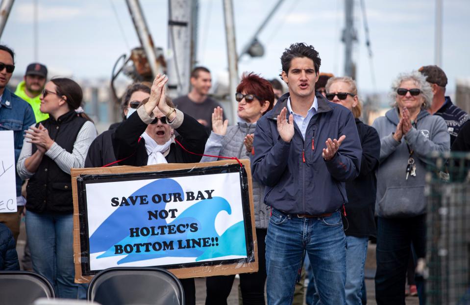 The crowd applauding to the speakers after the speech during the rally against Holtec releasing wastewater from the decommissioned Pilgrim Nuclear Power Station into the Cape Cod Bay in Plymouth on Saturday, April 9, 2022.