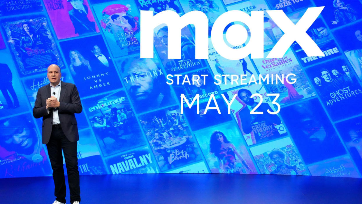  JB Perette stands in front of the new logo for the Max streaming service 