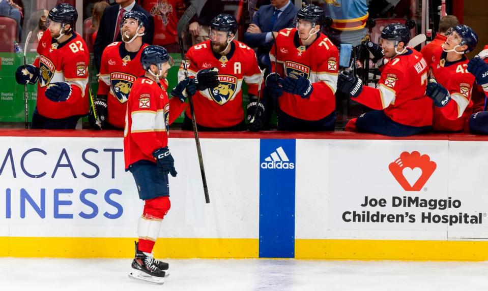 Florida Panthers center Sam Reinhart (13) celebrates with his teammates after scoring a goal against the Colorado Avalanche in the first period of their NHL game at the Amerant Bank Arena on Saturday, Feb. 10, 2024, in Sunrise, Fla.