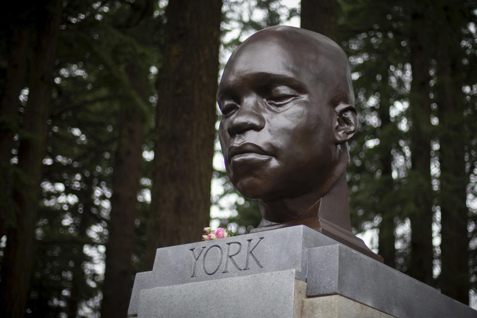 FILE - In this Sunday Feb. 21, 2021, file photo, the bust of York is seen on Mount Tabor in southeast Portland, Ore. Officials say the bust of York, commemorating an enslaved Black member of the Lewis and Clark Expedition was toppled and damaged. A Portland Parks and Recreation spokesperson told KOIN 6 News that the bust of York was torn from its pedestal and significantly damaged Tuesday night, July 27, or early Wednesday. (Mark Graves/The Oregonian via AP, File)