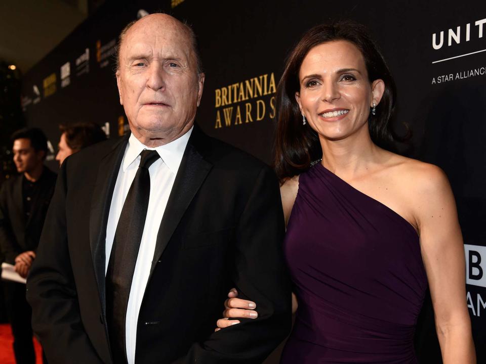 <p>Kevork Djansezian/BAFTA LA/Getty</p> Robert Duvall and Luciana Pedraza attend the BAFTA Los Angeles Jaguar Britannia Awards on October 30, 2014 in Beverly Hills, California. 