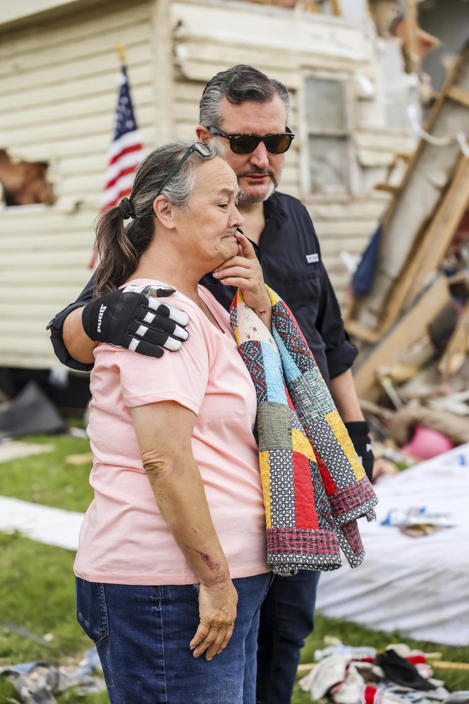 U.S. Sen. Ted Cruz, R-Texas, consoles a woman as he surveys the damage of her home from a recent tornado in Perryton, Texas, Saturday, June 17, 2023. (AP Photo/David Erickson)