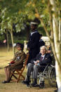 Veterans and military personnel attend the national service of remembrance marking the 75th anniversary of V-J Day at the National Memorial Arboretum in Alrewas, England, Saturday Aug. 15, 2020. Following the surrender of the Nazis on May 8, 1945, V-E Day, Allied troops carried on fighting the Japanese until an armistice was declared on Aug. 15, 1945. (Oli Scarff/PA via AP)