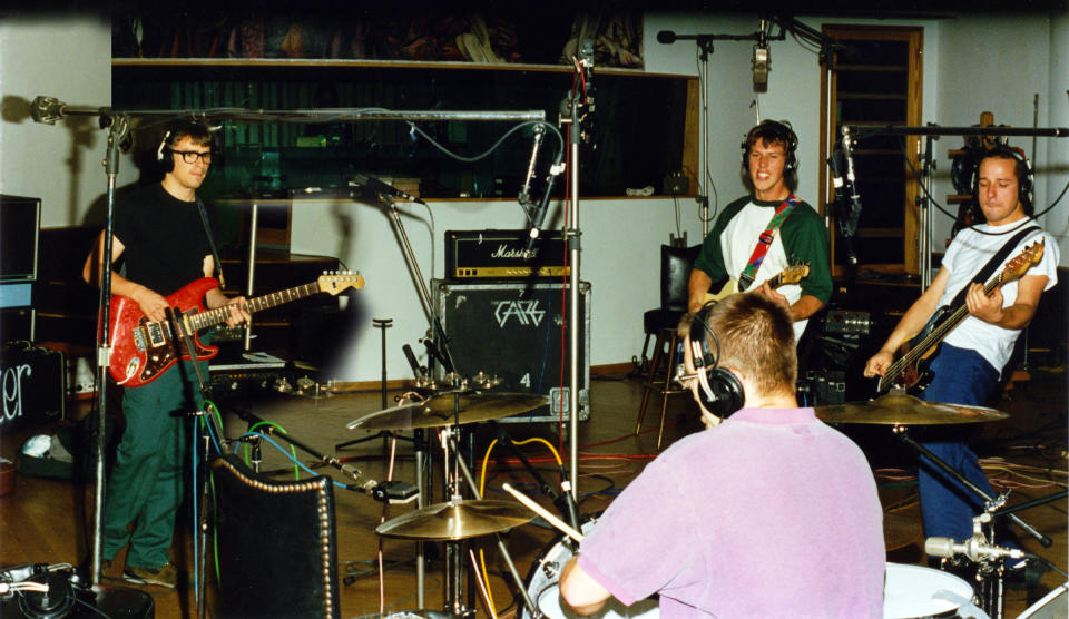Out of the Garage: Weezer recording the Blue Album in 1993. Recalls drummer Wilson, “We were totally nerds. Rivers was smart enough to realize, ‘I need to not look like a nerd.’ I never gave a shit. I just wanted to play.” Photo credit: Karl Koch - Credit: Karl Koch