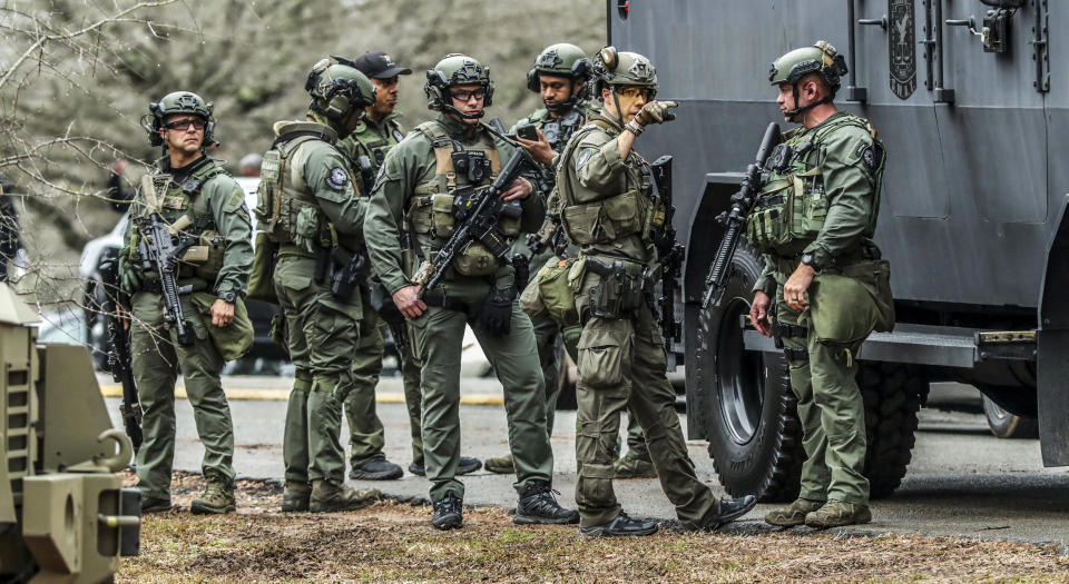 DeKalb and Atlanta SWAT members leave the Gresham Park command post in Atlanta on Jan. 18, 2023. (John Spink / Atlanta Journal-Constitution via AP file)