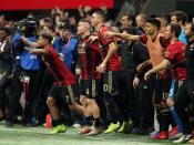 Dec 8, 2018; Atlanta, GA, USA; Atlanta United forward Josef Martinez (7) and midfielder Miguel Almiron (10) celebrate after defeating the Portland Timbers in the 2018 MLS Cup championship game at Mercedes-Benz Stadium. Brett Davis-USA TODAY Sports