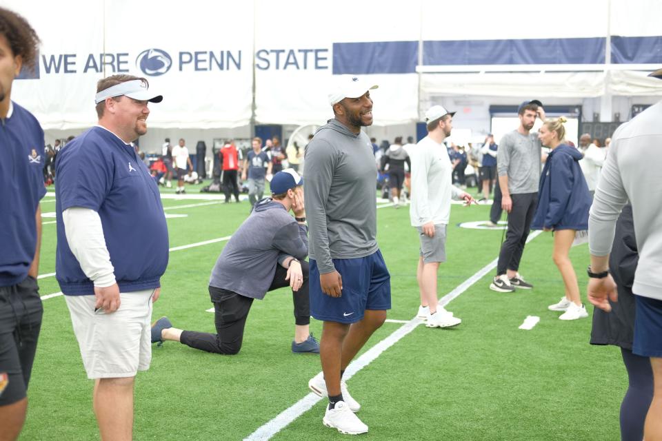 Penn State defensive analyst Ola Adams (center) is set to join Curt Cignetti's Indiana staff.