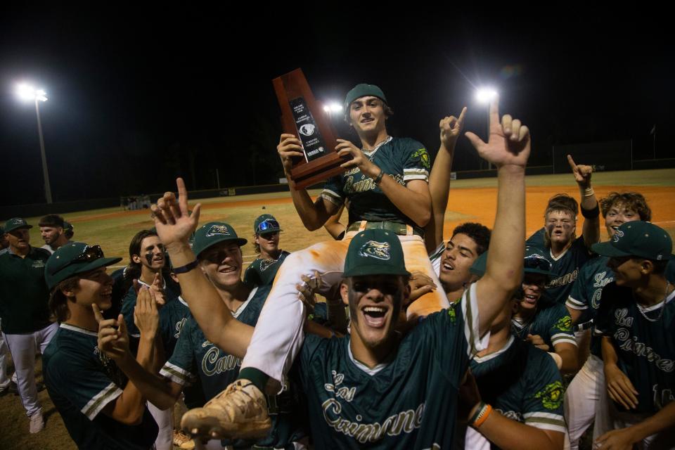 Members of Island Coast High School baseball team celebrates a district tile over Fort Myers High School at Island Coast in Cape Coral on Thursday, May 2, 2024.