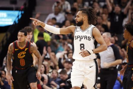 FILE PHOTO: Mar 28, 2019; San Antonio, TX, USA; San Antonio Spurs point guard Patty Mills (8) reacts during the first half against the Cleveland Cavaliers at AT&T Center. Mandatory Credit: Soobum Im-USA TODAY Sports