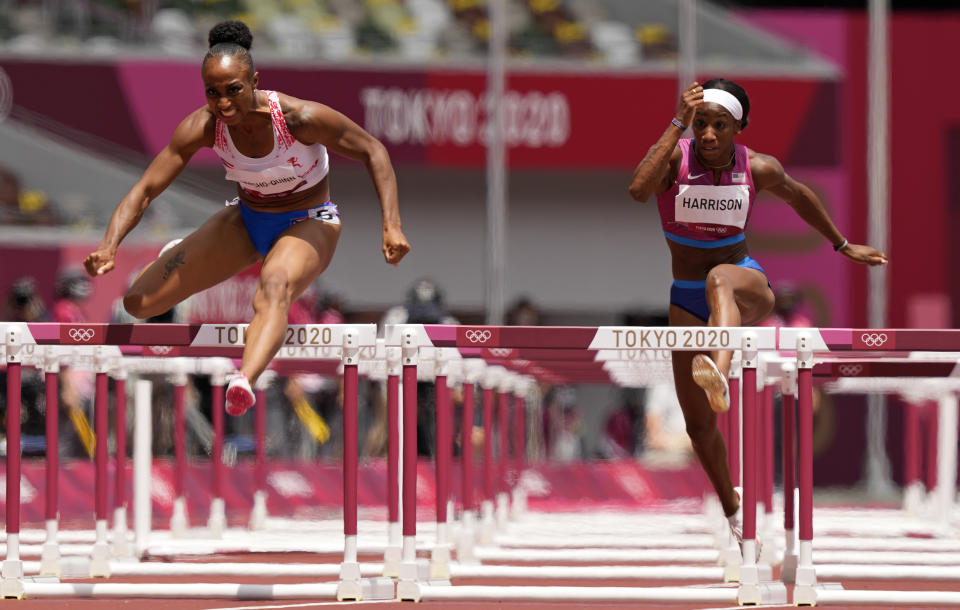 Jasmine Camacho-Quinn, of Puerto Rico, clears the final hurdle to win gold ahead of Kendra Harrison, of United States, silver, in the women's 100-meters hurdles final at the 2020 Summer Olympics, Monday, Aug. 2, 2021, in Tokyo, Japan. (AP Photo/Martin Meissner)