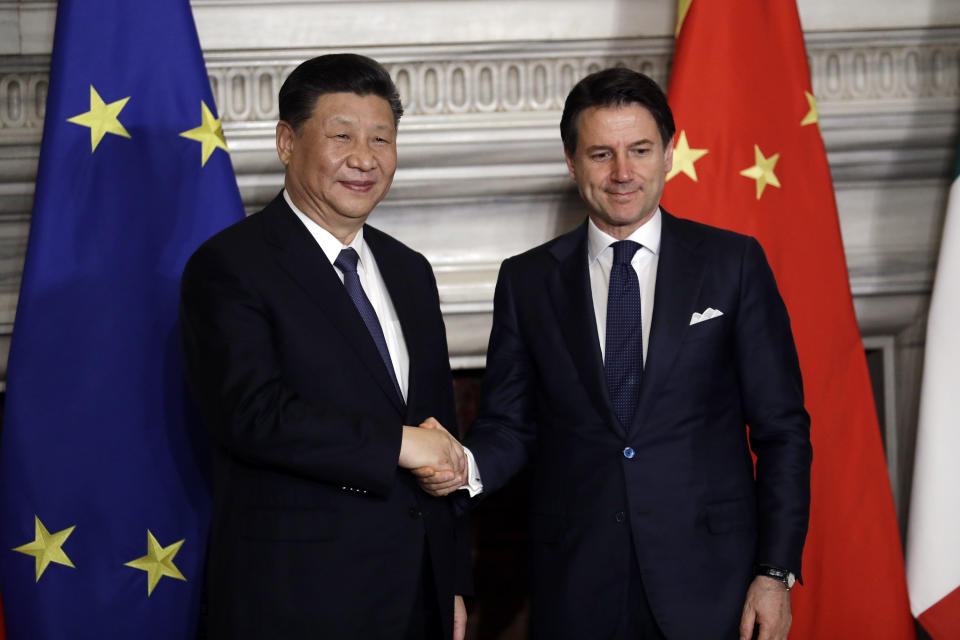 Chinese President Xi Jinping, left, and Italian Premier Giuseppe Conte shake their hands at the end of the signing ceremony of a memorandum of understanding at Rome's Villa Madama, Saturday, March 23, 2019. Jinping is in Italy to sign a memorandum of understanding to make Italy the first Group of Seven leading democracies to join China's ambitious Belt and Road infrastructure project. (AP Photo/Andrew Medichini)