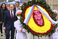 In this photo released by Russian Foreign Ministry Press Service, Russian Foreign Minister Sergey Lavrov, left, walks with a Vietnamese army official to lay wreath at Ho Chi Minh mausoleum in Hanoi, Vietnam on Wednesday July 6, 2022. Lavrov is on a trip to Asia to seek support amid his country's diplomatic isolation by the West and punishing sanctions leveled over its invasion of Ukraine.(Russian Foreign Ministry Press Service via AP)