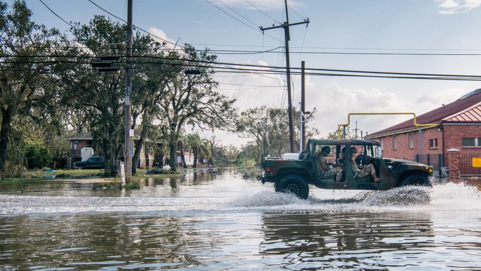 National Guard members drive through floodwater on Sept. 1, 2021, in Jean Lafitte, La. Category 4 Hurricane Ida made landfall days before, causing flooding and wind damage along the Gulf Coast. (Brandon Bell/Getty Images)