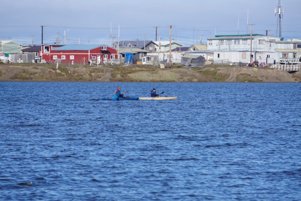 Kayakers paddle across Isatkoak Lagoon in Utqiagvik, the nation's northernmost community, on Aug. 6. The U.S. Arctic Research Commission is putting increased emphasis on scientific responses to the needs of the nation's Arctic residents. (Photo by Yereth Rosen/Alaska Beacon)