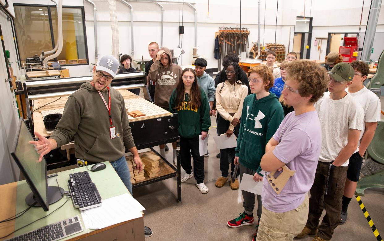 Industrial Arts instructor Tyler Tjernlund leads a class in the new wood shop at North Eugene High School.