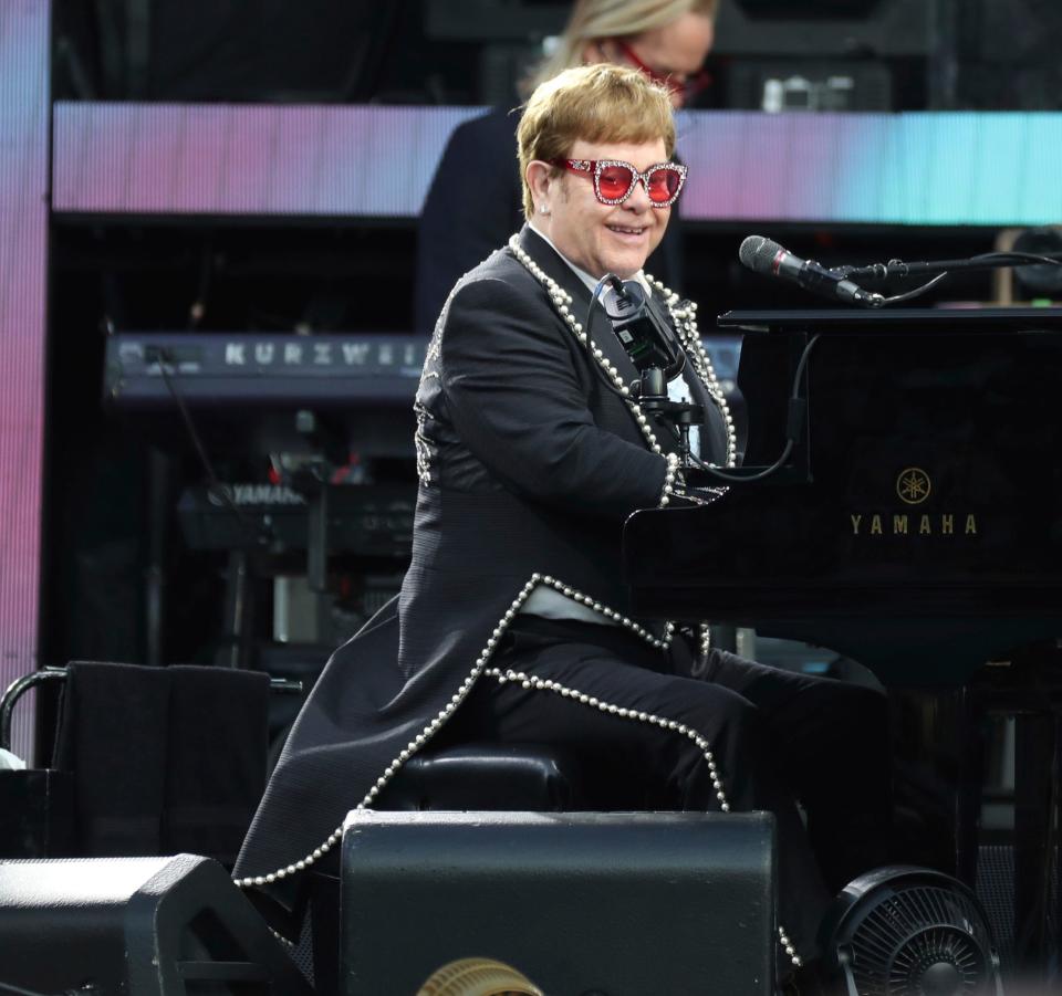 Elton John plays for fans during his farewell tour at Comerica Park Monday, July 18, 2022. 