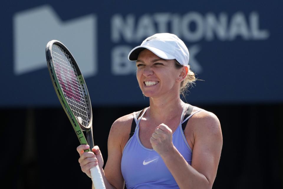 Simona Halep of Romania celebrates winning the women's singles final between Beatriz Haddad Maia of Brazil and Simona Halep of Romania at the 2022 National Bank Open tennis tournament in Toronto, Canada, Aug. 14, 2022. (Photo by Zou Zheng/Xinhua via Getty Images)