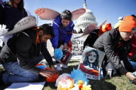 <p>Supporters of the Deferred Action for Childhood Arrivals (DACA) program place paper flowers on the ground in a pattern that spells out the word “unafraid” as they rally in support of DACA recipients, Monday, March 5, 2018, on Capitol Hill in Washington. (Photo: Jacquelyn Martin/AP) </p>