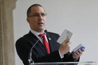 Venezuelan Foreign Minister Jorge Arreaza gives a news conference at his office moments after he met with European Union Ambassador to Venezuela Isabel Brilhante Pedrosa to give her a letter of "persona non grata," and giving her 72 hours to leave the country, in Caracas, Venezuela, Wednesday, Feb. 24, 2021. The meeting was called after the EU sanctioned an additional 19 Venezuelans for "undermining democracy and the rule of law" in Venezuela and the National Assembly declared the EU ambassador "persona non grata." (AP Photo/Ariana Cubillos)