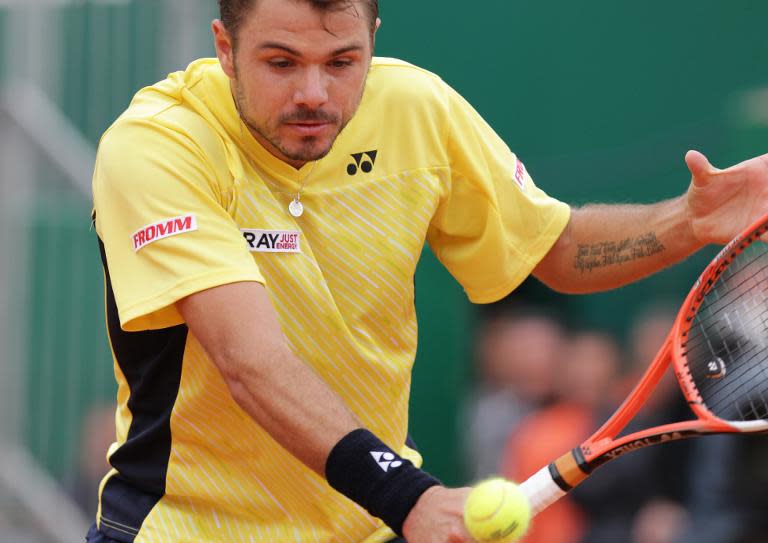 Switzerland's Stanislas Wawrinka returns Spain's David Ferrer, who he beats 6-1, 7-6 (7/3), on April 19, 2014 during their Monte-Carlo ATP Masters Series Tournament tennis match in Monaco