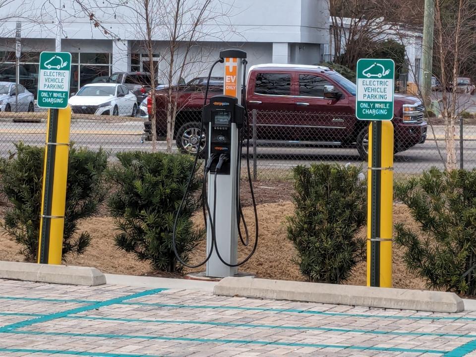 EV chargers in the parking lot of Home 2 Suites hotel near the intersection of Market Street and Eastwood Road. Some businesses see chargers as a way of attracting business and catering to the growing number of EV drivers on the road.