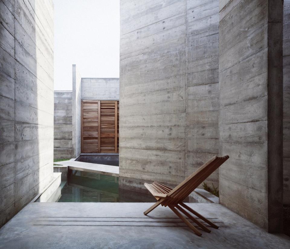 A narrow swimming pool allows the Zicatela House's inhabitants to swim through the concrete walls with ease.