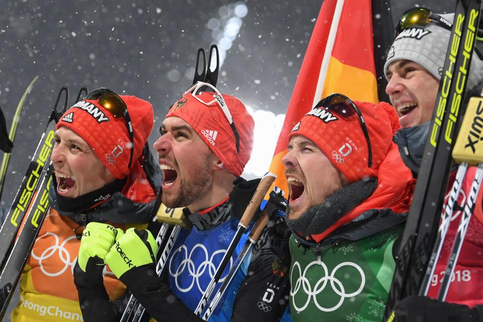 <p>Germany’s Johannes Rydzek, Vinzenz Geiger, Fabian Riessle, and Eric Frenzel celebrate winning gold during the Nordic Combined Team Gundersen LH/4x5km, Cross-Country at the 2018 Winter Olympic Games in PyeongChang, South Korea, February 22, 2018.<br> (Photo by Christof Stache/AFP/Getty Images) </p>
