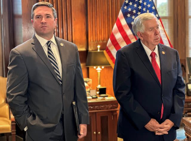 <p>AP Photo/David A. Lieb</p> Missouri Attorney General Andrew Bailey (left) with Gov. Mike Parson (right) at a press conference regarding unregulated psychoactive cannabis products at the state Capitol in Jefferson City, Mo. Aug. 1, 2024.